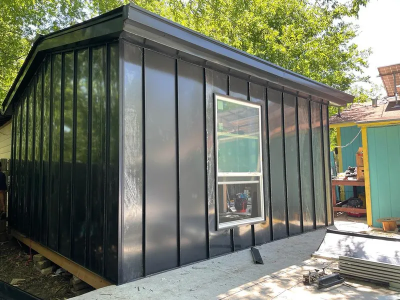 Black standing seam metal wall panels for Metal Roof Installation in Owasso