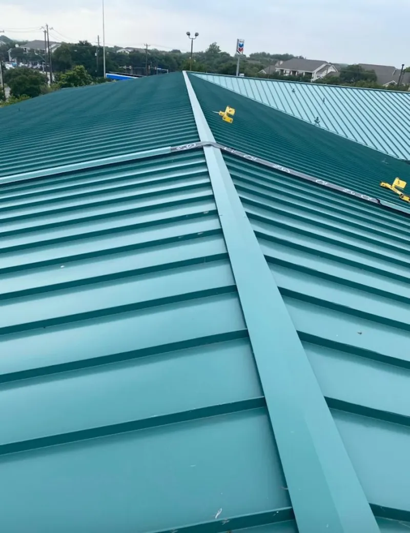Green commercial metal roof ridge and valley for Metal Roof Repair in Owasso